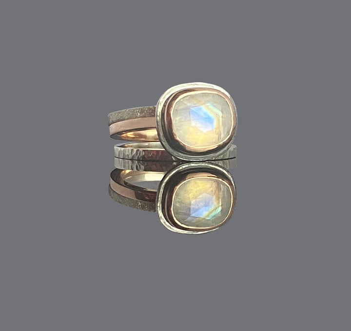 9ct red gold wraps around this rose-cut moonstone. The marriage of red gold and silver works so well here!
